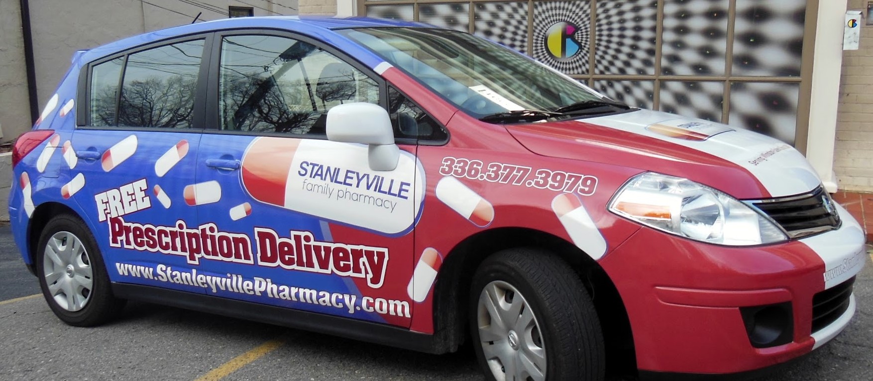 Stanleyville Family Pharmacy vehicle full wraps right angle view